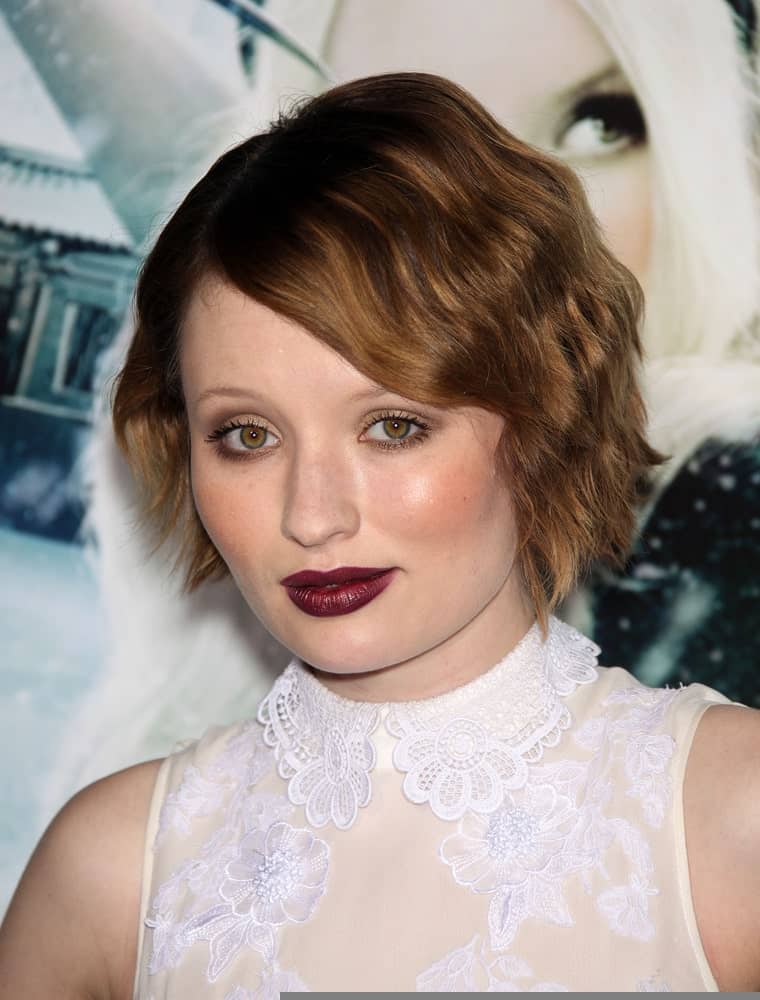 Emily Browning attended the "Sucker Punch" World Premiere on March 23, 2011 in Hollywood, CA. She was lovely in a white sheer dress and topped it with a pixie brunette hairstyle with curls and long side-swept bangs.