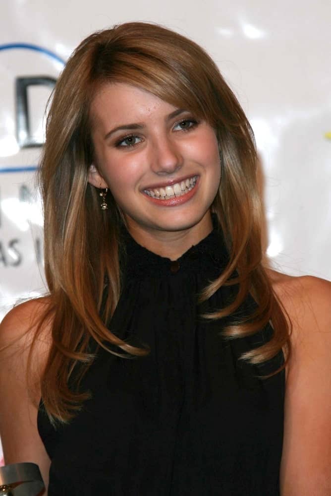 Emma Roberts attended the ShoWest 2007 Awards Ceremony in Paris Hotel, Las Vegas, NV on March 15, 2007. She wore a lovely black outfit with her long and layered brunette hairstyle that is loose and tousled.