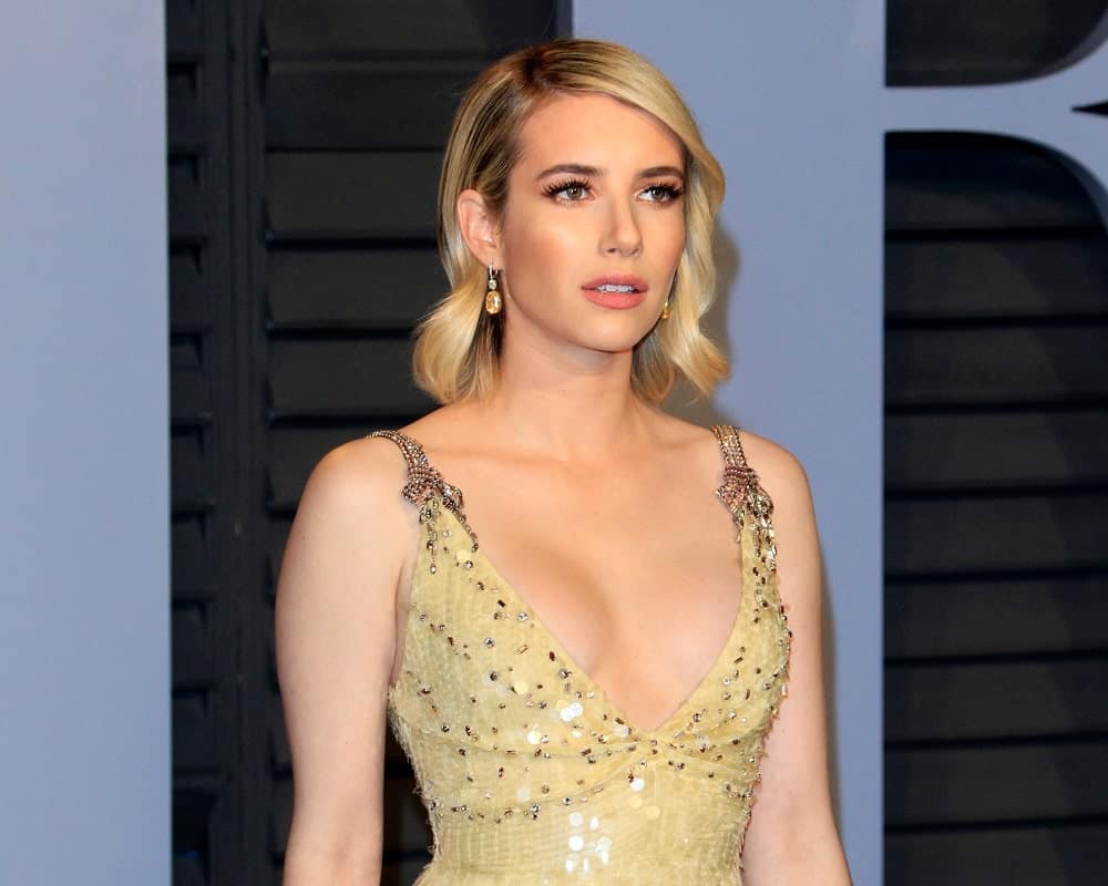 Emma Roberts was at the 24th Vanity Fair Oscar After-Party at the Wallis Annenberg Center for the Performing Arts on March 4, 2018 in Beverly Hills, CA. She was stunning in a golden dress that she topped with a shoulder-length tousled sandy-blonde hairstyle with waves and side-swept bangs.