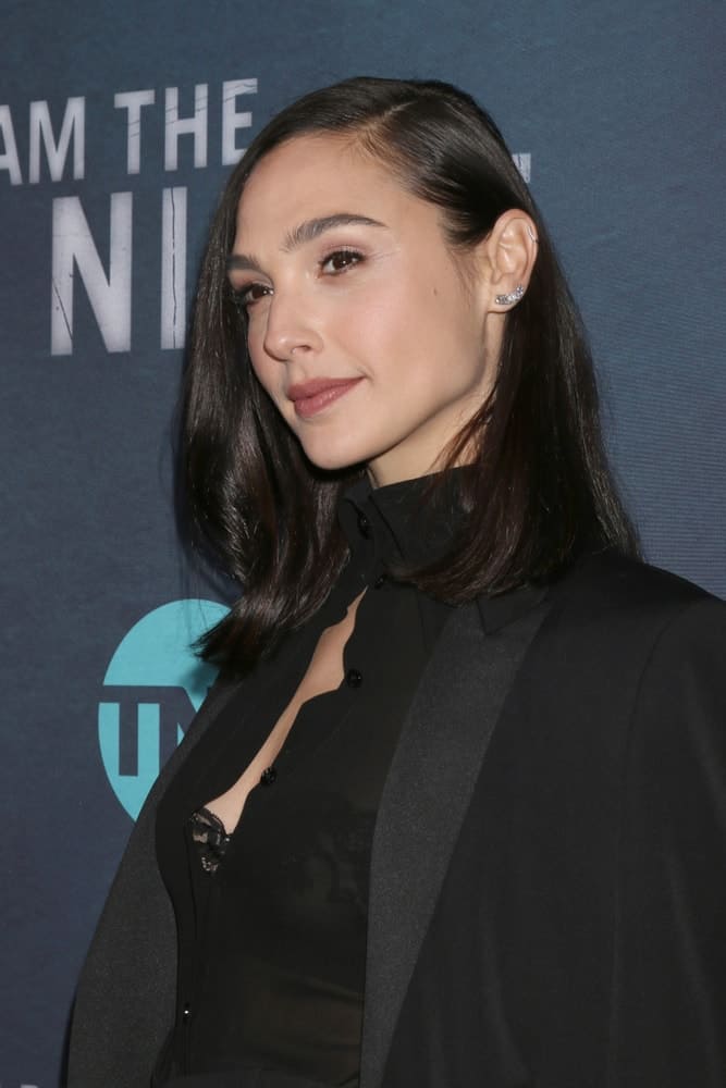 Gal Gadot attended the "I Am The Night" Premiere Screening at the Harmony Gold Theater on January 24, 2019 in Los Angeles, CA. She wore an all-black outfit to pair with her shoulder-length side-swept raven hairstyle with waves at the tips.