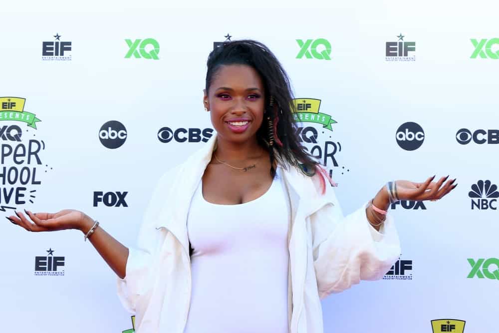 Jennifer Hudson was at the EIF Presents: XQ Super School Live at the Barker Hanger on September 8, 2017 in Santa Monica, CA. She wore an all-white dress with her side-swept tousled hairstyle with a shaved side.