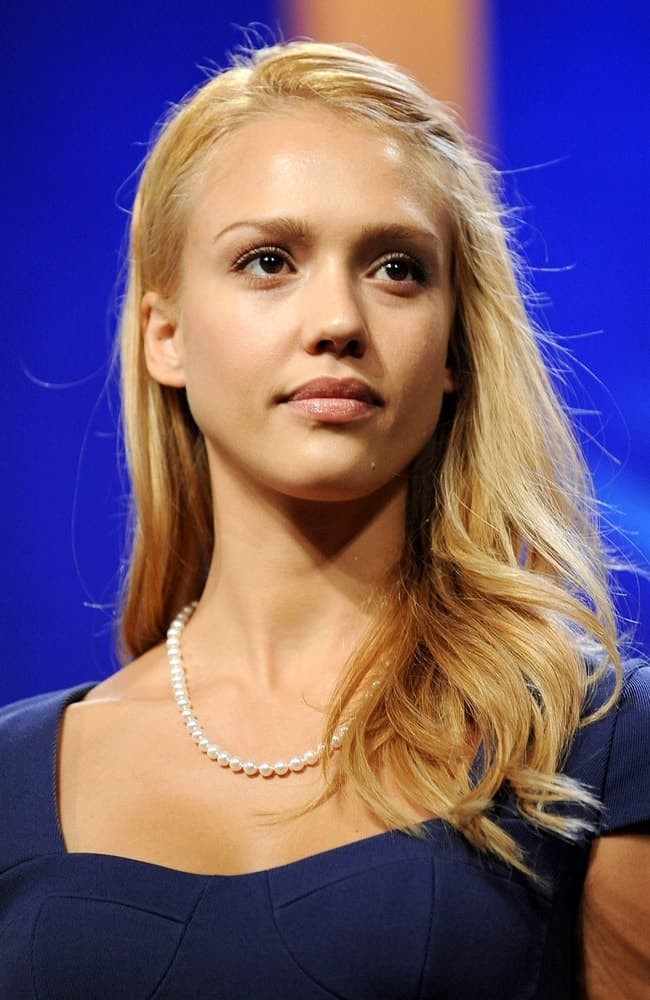Jessica Alba dyed her hair into a sandy blond tone and styled it into a side-swept tousled and loose hairstyle at a public appearance for Clinton Global Initiative in Sheraton New York Hotel and Towers, New York, NY on September 24, 2009.