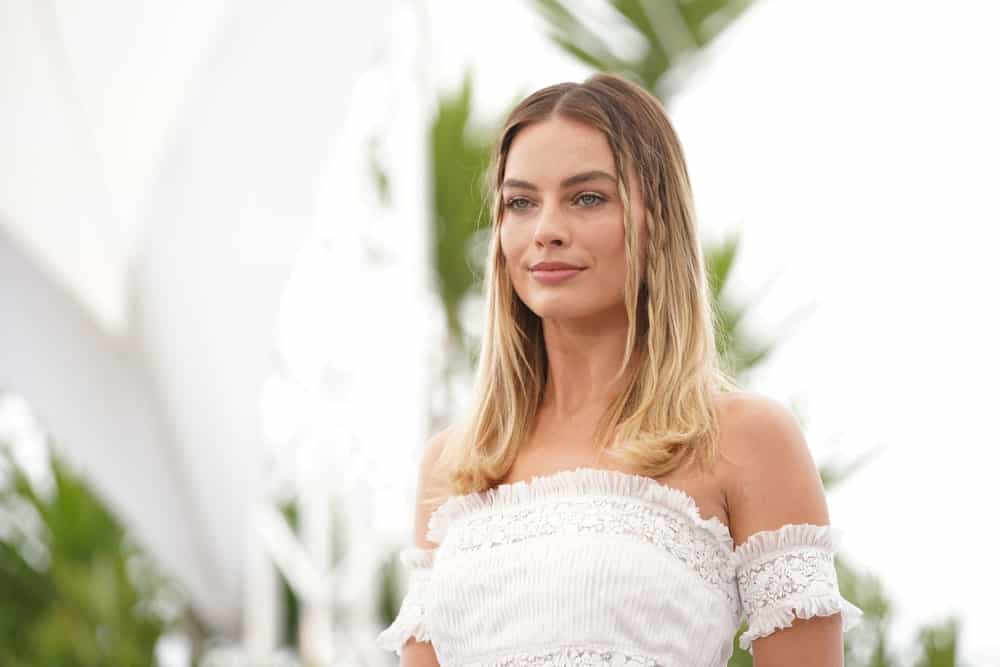 Margot Robbie incorporates her loose center-parted locks with side braids during the photocall for "Once Upon A Time In Hollywood" last May 22, 2019.