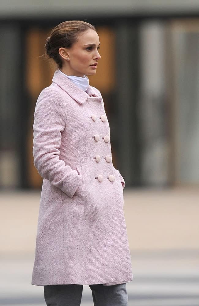 Natalie Portman was seen on location for BLACK SWAN Film Shoot in Manhattan, Lincoln Center, New York, NY on December 7, 2009. She was seen wearing a beautiful long coat that she paired with a neat bun hairstyle with a slick finish.