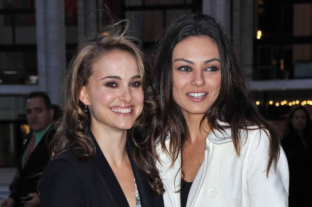 Natalie Portman and Mila Kunis were at the American Ballet Theatre 2009 Fall Season Gala in Avery Fisher Hall at Lincoln Center, New York, NY on October 7, 2009. Portman wore a black jacket with her long highlighted brunette hairstyle with curls at the tips.