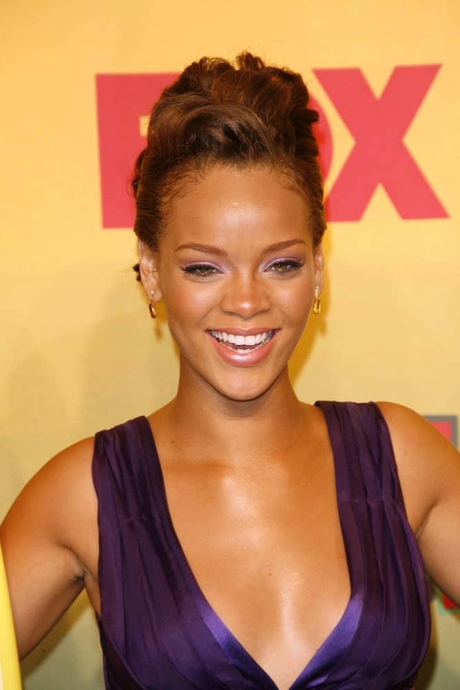Rihanna wore an elegant and charming purple dress with her detailed upstyle with gorgeous wavy tousle at the top at the 2006 Teen Choice Awards - Press Room at Gibson Amphitheatre on August 20, 2006 in Universal City, CA.