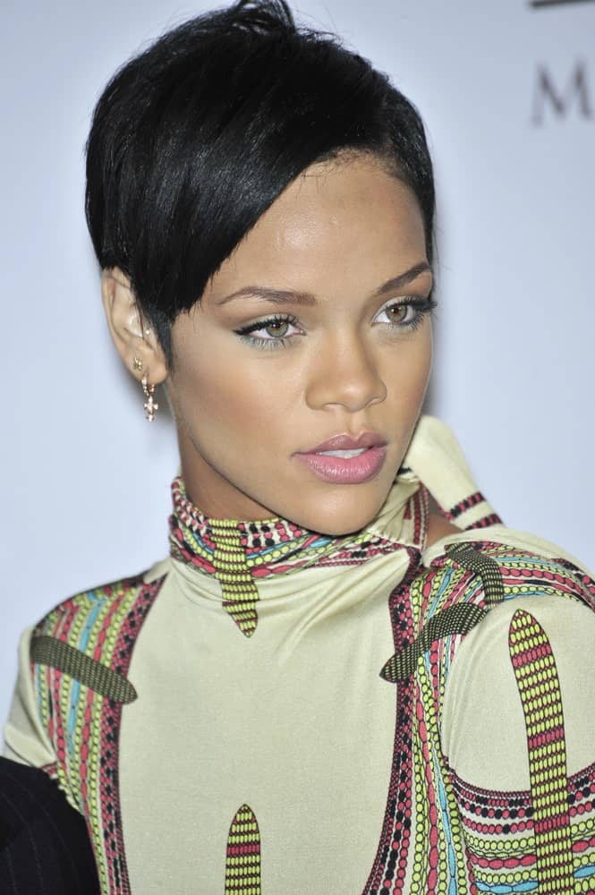 Rihanna attended the music mogul Clive Davis' annual pre-Grammy party at the Beverly Hilton Hotel on February 9, 2008 in Los Angeles, CA. She came wearing a vintage colorful outfit and paired it with a raven pixie hair that is straightened and side-swept.