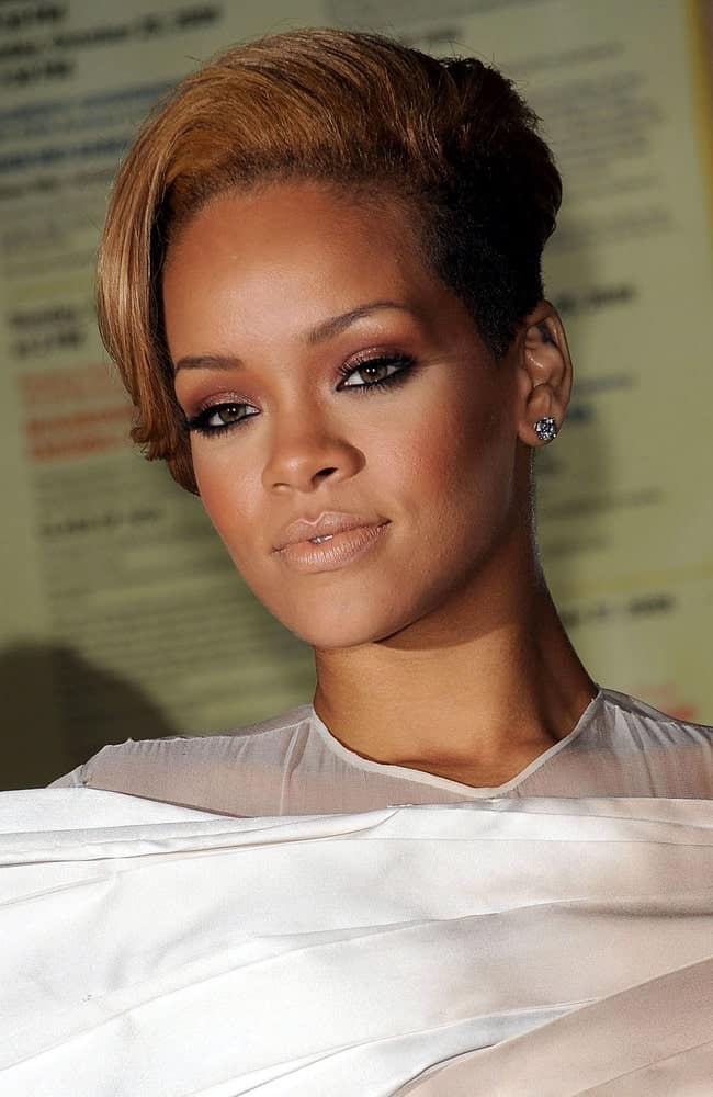Rihanna's simple makeup and white dress went great with her side-swept short brown hairstyles with a shaved side at the GLAMOUR Women of the Year Awards in Carnegie Hall, New York, NY on November 9, 2009.