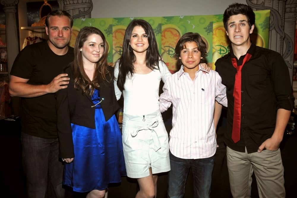 Selena Gomez posed with his co-stars from "Wizards of Waverly Place" at the press conference for New York Times Talks at The Times Center in New York on Sept ember 06, 2008. Gomez was lovely in her casual white outfit and long straight layered hairstyle.
