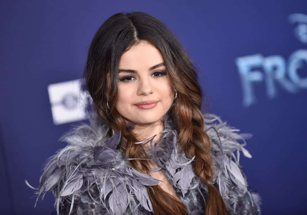 Selena Gomez was at the ‘Frozen II’ Premiere on November 07, 2019 in Hollywood, CA. She came wearing a feathered gray outfit and paired it with a loose dual braided hairstyle that goes down on her shoulders.