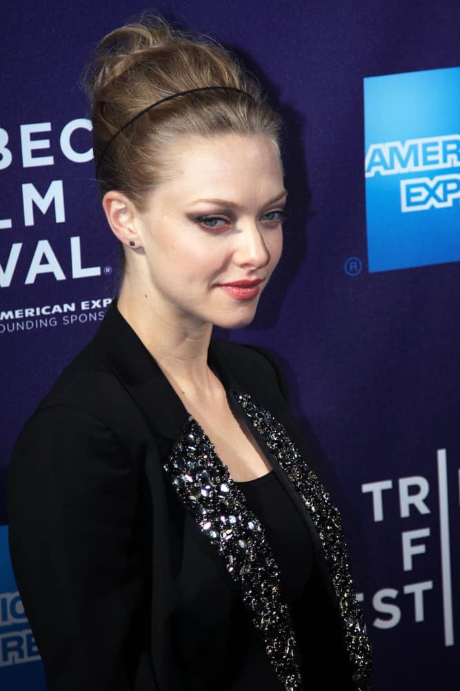 Actress Amanda Seyfried was quite charming in her glittery black coat and her bun hairstyle that has a slight beehive finish at the "Letters to Juliet" premiere at the School of Visual Arts Theater during the 2010 TriBeCa Film Festival on April 25, 2010 in New York City.