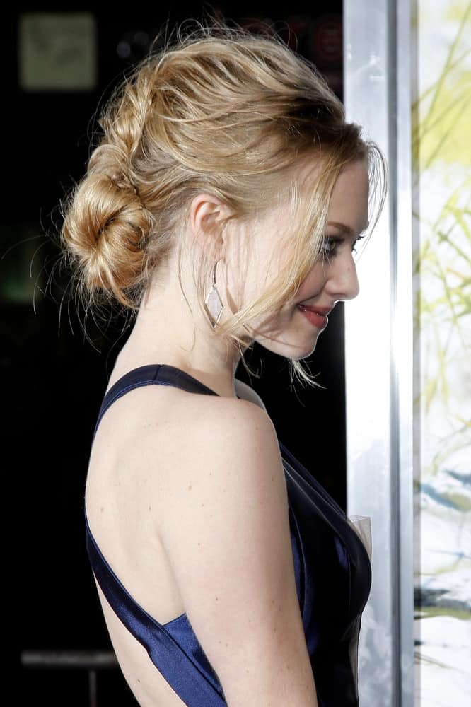 Amanda Seyfried wore a blue dress with her messy low bun hairstyle that has loose tendrils at the Dear John Premiere at Grauman`s Chinese Theater, in Los Angeles, California on February 1, 2011.