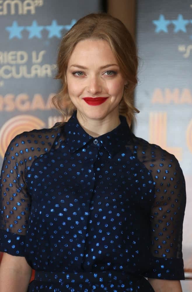 Amanda Seyfried wore a lovely black and blue polka-dotted dress that went quite well with her bold red lips and messy bun hairstyle with loose tendrils on the side at the Lovelace - special screening held at the May Fair hotel in London on September 12, 2013.