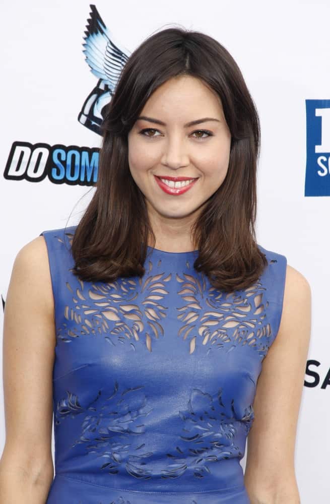 Aubrey Plaza attended the 2012 Do Something Awards held at the Barker Hangar in Los Angeles on August 19, 2012. She was seen wearing a blue leather dress to go with her loose and tousled shoulder-length raven hairstyle with layers.