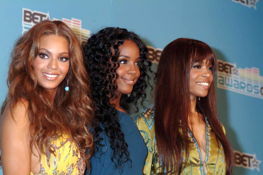 Destiny's Child in the press room for BET Awards 2005 at The Kodak Theatre, Los Angeles, CA held on June 28, 2005. She wore a yellow floral dress along with a layered wavy hairstyle with a middle parting.