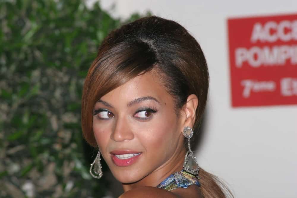 Beyonce Knowles arrived for the 'Dreamgirls' premiere at the Martinez Hotel during the 59th International Cannes Film Festival on May 19, 2006. She pulled off a glam updo that's incorporated with long side-swept bangs.