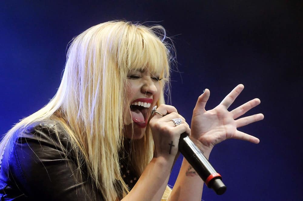 On April 19, 2012, Singer Demi Lovato performed during her show at the Cittibank Hall in Rio de Janeiro, Brazil. She was seen performing with a long and straight layered blond hairstyle incorporated with blunt bangs.