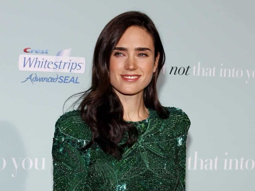 Jennifer Connelly attended the World premiere of 'He's Just Not That Into You' held at the Grauman's Chinese Theater in Hollywood on February 2, 2009. She was seen wearing a green dress with her long and wavy side-swept dark hairstyle with a slight tousle.