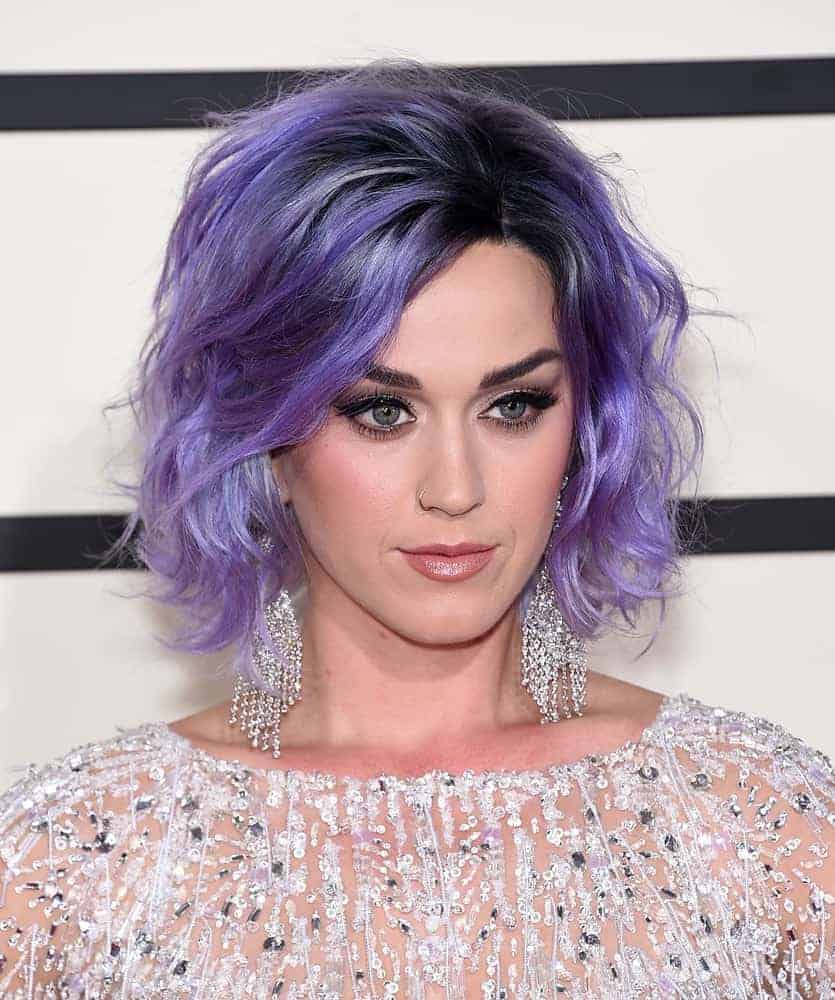 Katy Perry rocks a purple tousled hairstyle to complement her crystal-embellished sheer dress at the Grammy Awards 2015. A really unique short hairstyle for a playful artist like her!