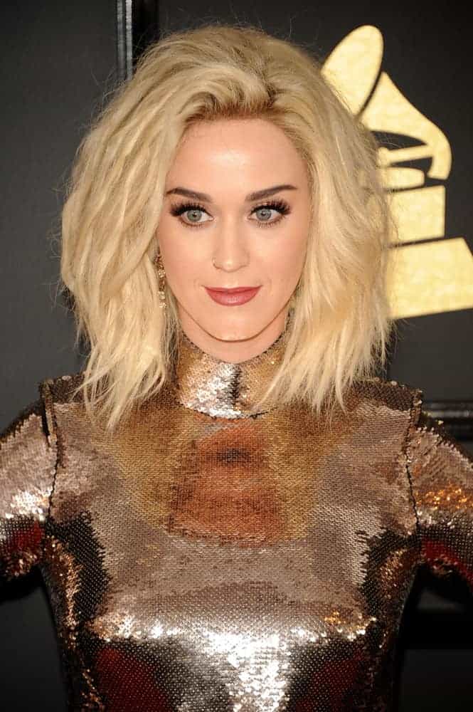 Katy Perry looked majorly glam in a slinky metallic, sequined gown and her hair in a tousled blonde bob, all for the 59th GRAMMY Awards.