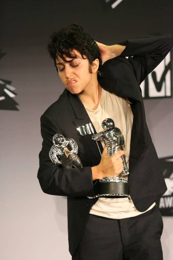 Lady Gaga was at the 2011 MTV Video Music Awards Press Room, Nokia Theatre LA Live in Los Angeles on August 28, 2011. She came dressed as a man wearing a smart casual outfit and matching raven curly pompadour hairstyle.