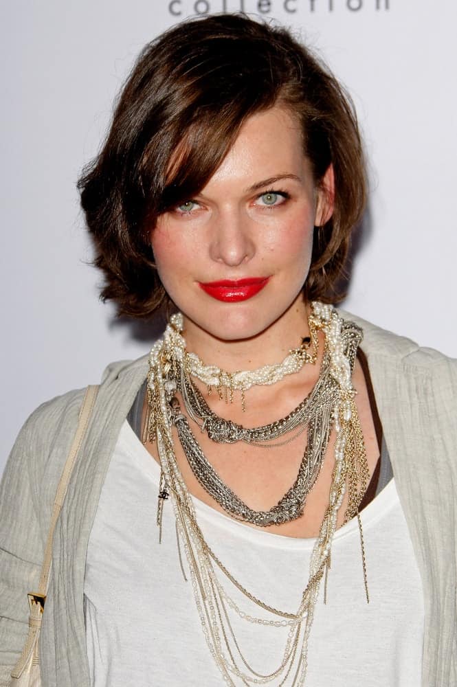 Milla Jovovich was at the Calvin Klein Collection & Los Angeles Nomadic Division 1st Annual Celebration on January 28, 2010 in Los Angeles, California. She was seen wearing a fashionable casual outfit with her chin-length brunette hairstyle with side-swept bangs.