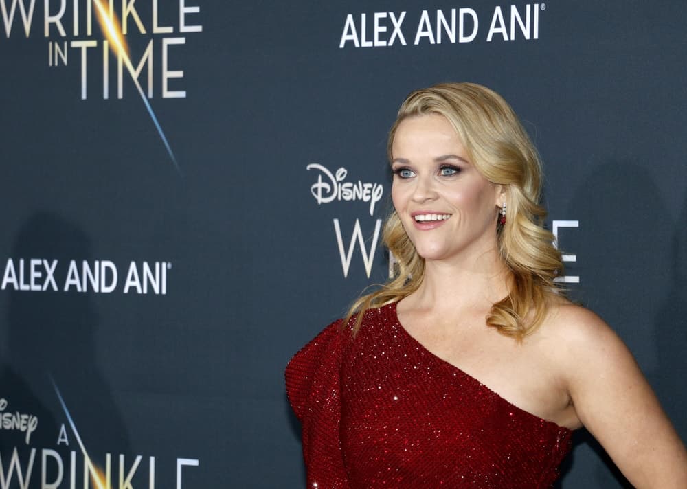 Reese Witherspoon was quite charming in her red sequined dress and side-swept wavy blond hairstyle that has highlights and layers at the Los Angeles premiere of 'A Wrinkle In Time' held at the El Capitan Theater in Hollywood, USA on February 26, 2018.