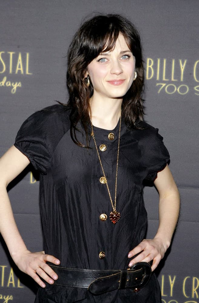 Zooey Deschanel attended the Opening Night of 700 Sundays in Wilshire Theatre, Los Angeles, CA on January 12, 2006. She was seen wearing a simple black dress with her shaggy shoulder-length tousled hairstyle with layers.