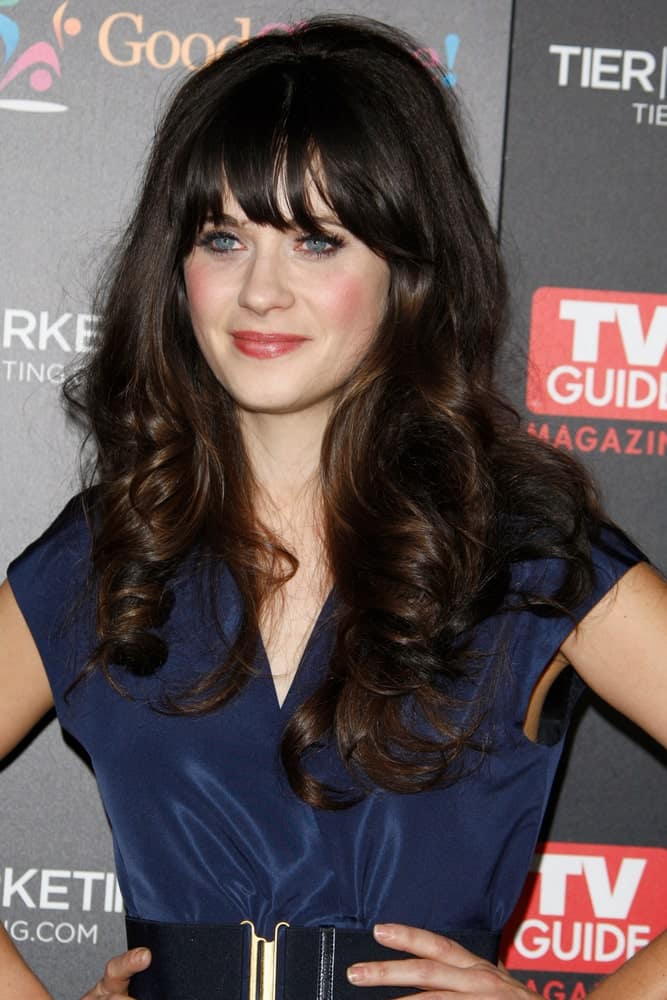 Zooey Deschanel attended the TV Guide Magazine Hot List Party at the Greystone Manor on November 7, 2011 in Los Angeles, CA. She wore a charming blue dress with her long and tousled dark hairstyle that has spiral curls and layers.