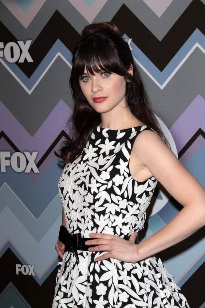 Zooey Deschanel was at the FOX Winter TCA All-Star Party 2013, Langham Huntington Hotel in Pasadena, CA on January 8, 2013. She was charming in a floral black dress to pair with her long raven half-up hairstyle that has a slight tousle.
