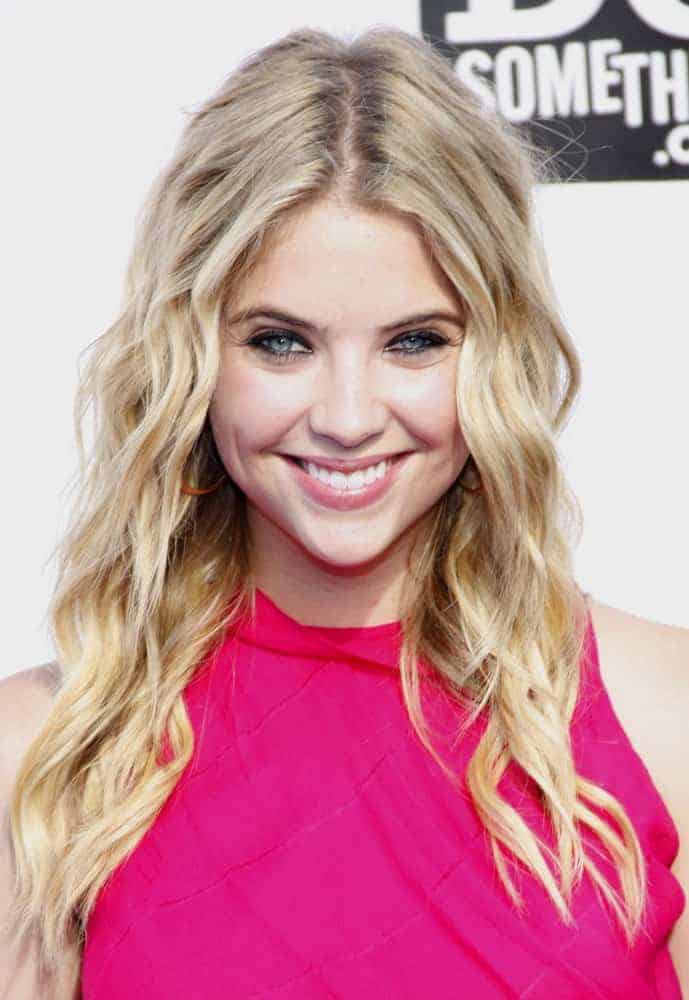 Ashley Benson attended the 2011 VH1 Do Something Awards held at the Palladium Hollywood in Los Angeles, California on August 14, 2011. She paired her bright pink dress with a long wavy and layered sandy blonde hairstyle with a tousled and loose finish.