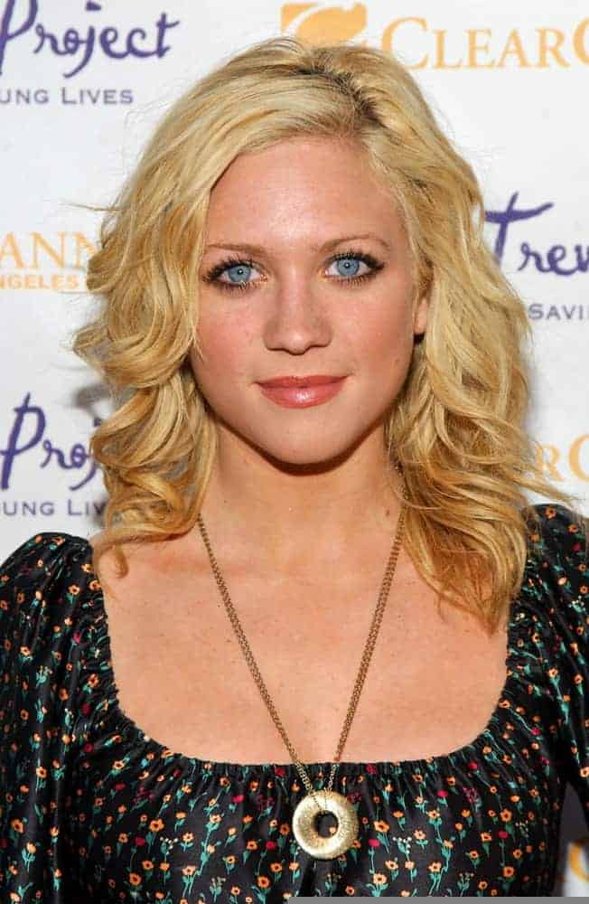 Brittany Snow was at The Trevor Project's "Cracked Xmas 9" Benefit at The Wiltern LG in Los Angeles, California on December 3, 2006. She wore a floral black dress with her shoulder-length tousled and curly blonde hairstyle that has subtle highlights.