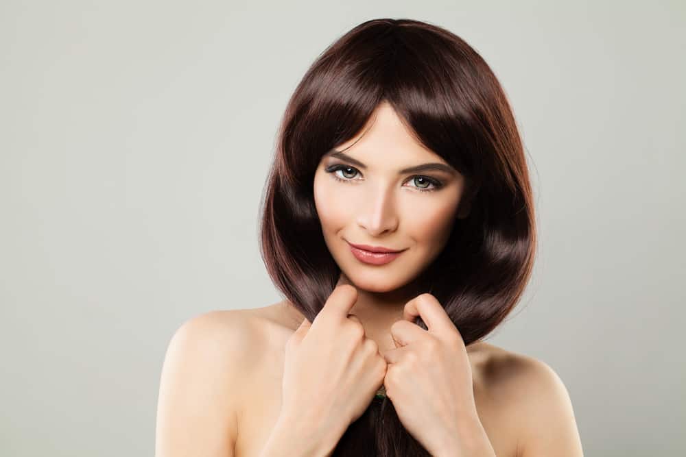 Example of woman with curtain bangs.