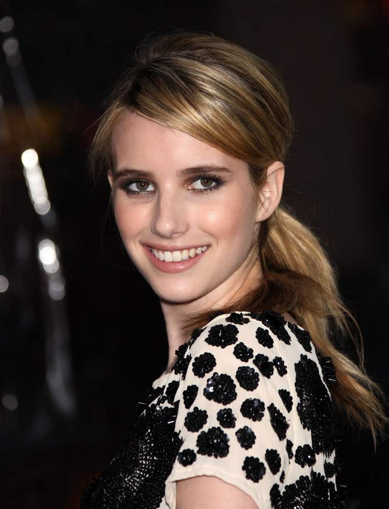 Emma Roberts attended the "Sucker Punch" World Premiere on March 23, 2011 in Hollywood, CA. She paired her black and white casual outfit with a tousled and highlighted blonde low ponytail hairstyle.