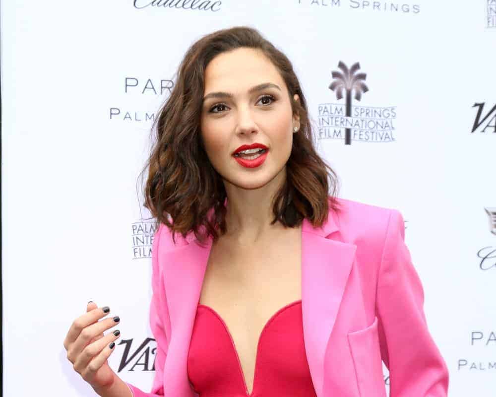 Gal Gadot attended the PSIFF Creative Impact Awards & "10 Directors to Watch" at Parker Palm Springs on January 3, 2018, in Palm Springs, CA. She wore an all-pink outfit to pair with her shoulder-length tousled wavy hairstyle with highlights and a side-swept finish.