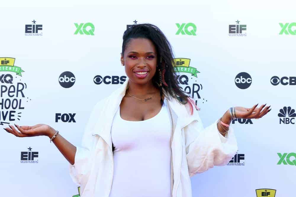 Jennifer Hudson was at the EIF Presents: XQ Super School Live at the Barker Hangar on September 8, 2017 in Santa Monica, CA. She wore an all-white dress with her side-swept tousled hairstyle with a shaved side.