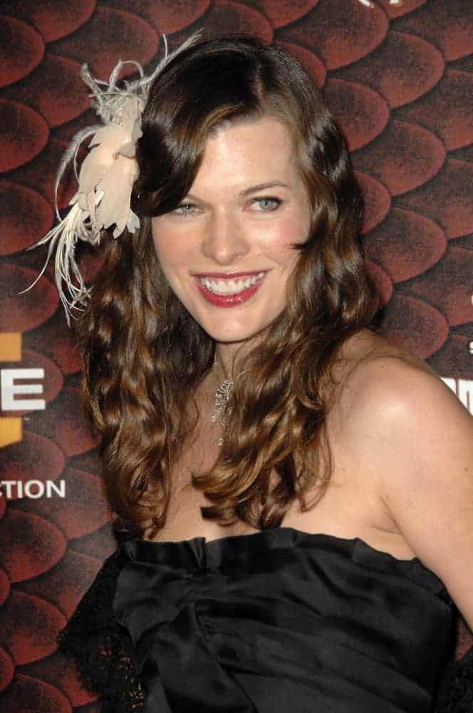 Milla Jovovich attended the Spike Tv's 'Scream 2008' held at the Greek Theatre in Hollywood, CA on October 18, 2008. She came wearing a black strapless dress with her long and curly brunette hairstyle incorporated with a ribbon and side-swept bangs.