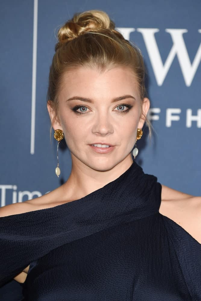Natalie Dormer gathered her long blonde locks in a slicked high bun at the 2018 IWC Schaffhausen Gala Dinner in Honour of the BFI at the Electric Light Station, London last October 9, 2018. 