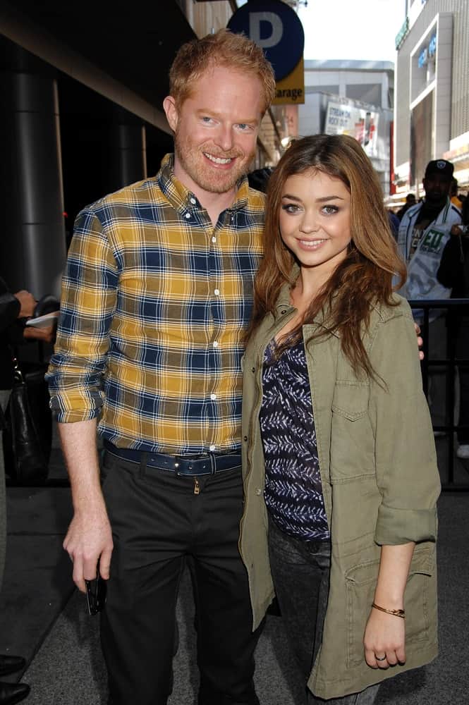 Jesse Tyler Ferguson and Sarah Hyland attended the Lakers Casino Night on March 10, 2013 in Los Angeles, CA. Hyland wore a cool jacket over her casual outfit and paired it with a loose and tousled brunette hairstyle with layers.
