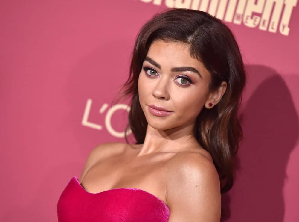 Sarah Hyland attended the Entertainment Weekly Pre-Emmy Party on September 20, 2019 in West Hollywood, CA. She was lovely in her strapless dress and long brunette hairstyle with long bangs, layers and subtle highlights.