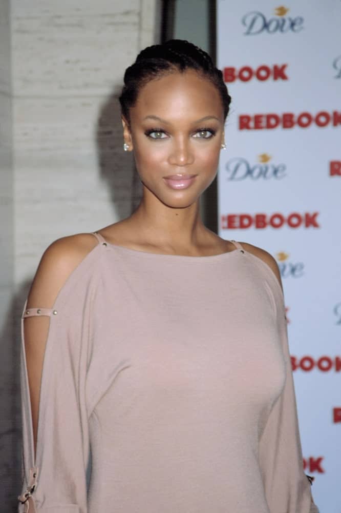 Tyra Banks attended the Redbook's Mothers & Shakers Awards in New York on September 19, 2002. She wore a classy gray dress that she paired with a stylish braided cornrows hairstyle.