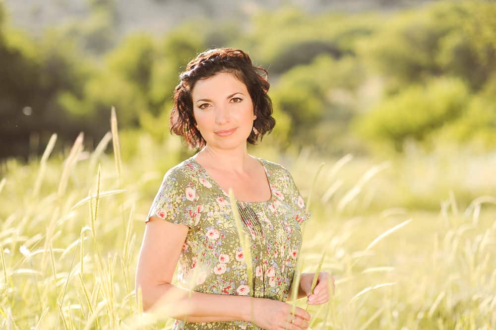Woman over 50 with curly brunette hair
