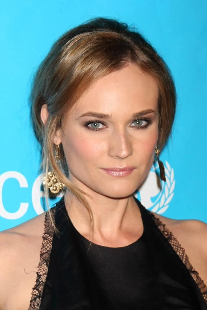 The actress gathered her long locks into a low ponytail with loose tendrils framing her face at the 2011 UNICEF Ball on December 8, 2011. The actress gathered her long locks into a low ponytail with loose tendrils framing her face at the 2011 UNICEF Ball on December 8, 2011.