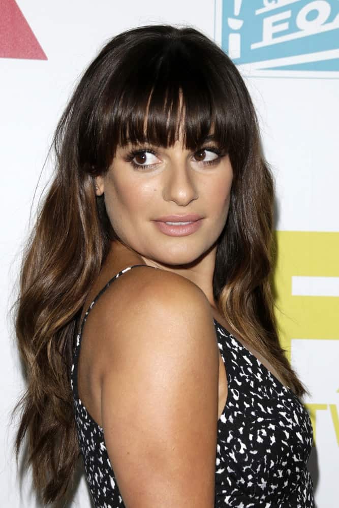 Lea Michele looks so adorable in this wavy loose hairstyle with blunt bangs at the 20th Century Fox Party Comic-Con Party on July 10, 2015. Lea Michele looks so adorable in this wavy loose hairstyle with blunt bangs at the 20th Century Fox Party Comic-Con Party on July 10, 2015.