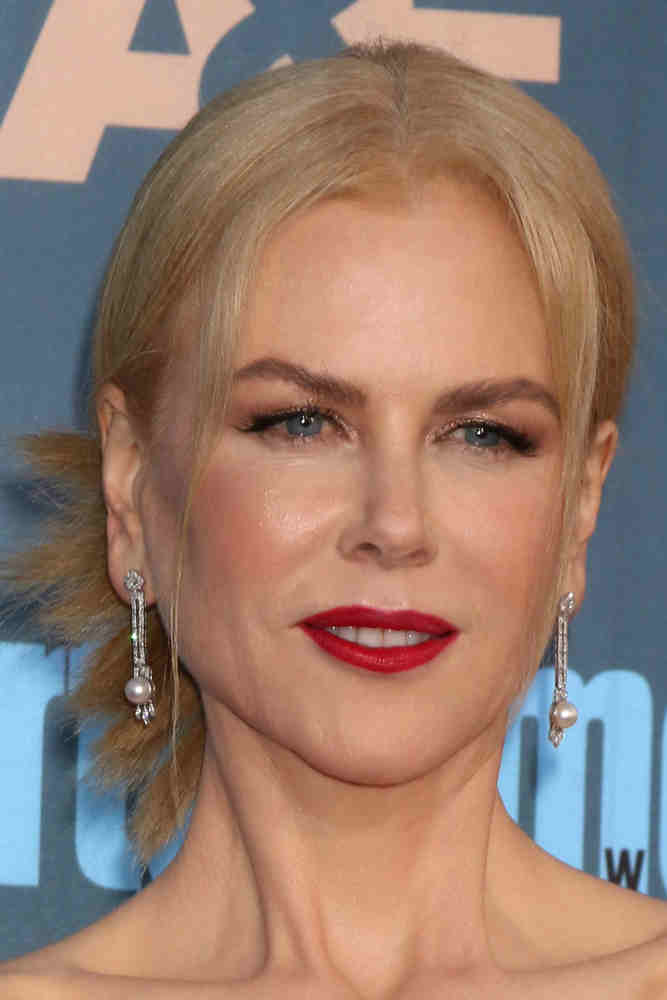 The actress paired her sophisticated makeup with a low, twisted updo with long parted bangs framing her face at the 22nd Annual Critics' Choice Awards on December 11, 2016. The actress paired her sophisticated makeup with a low, twisted updo with long parted bangs framing her face at the 22nd Annual Critics' Choice Awards on December 11, 2016.