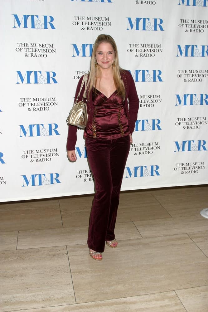 Ashley Benson was at the 40 Years of Days of our Lives at the Museum of TV and Radio on November 4, 2005 in Beverly Hills, CA. She wore a maroon ensemble outfit with her long and straight half-up blonde hairstyle.