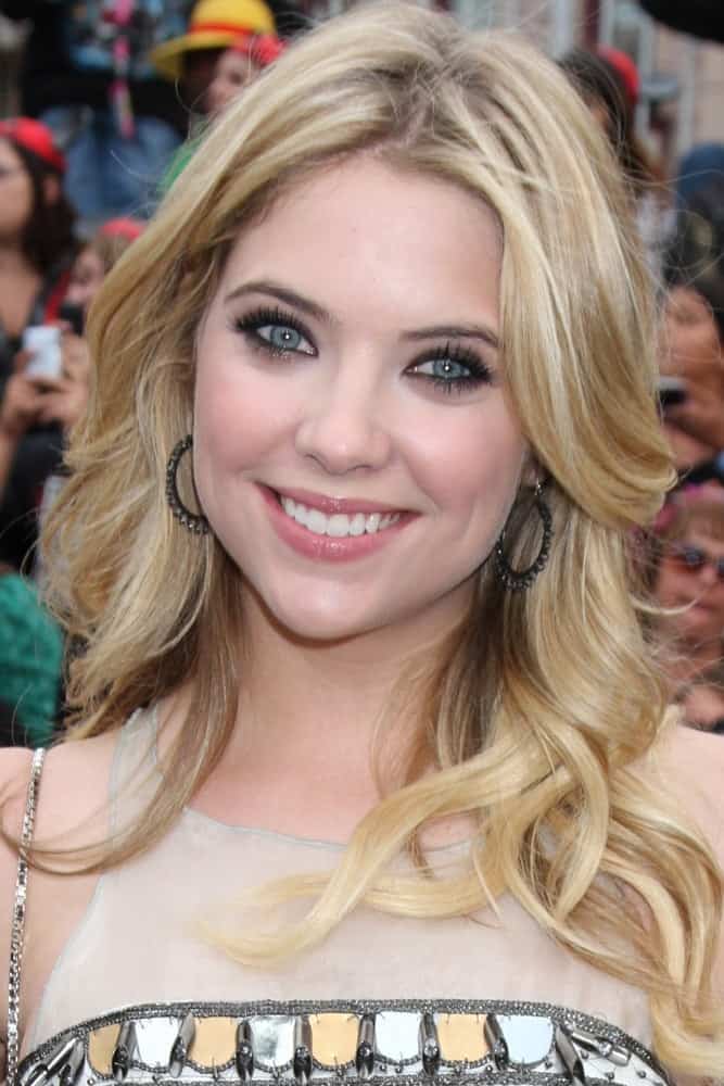 Ashley Benson was at the "Pirates of The Caribbean: On Stranger Tides" World Premiere at Disneyland on May 7, 2011 in Anaheim, CA. She was stunning in her beige dress and long layered sandy blonde hairstyle that is stylishly tousled.