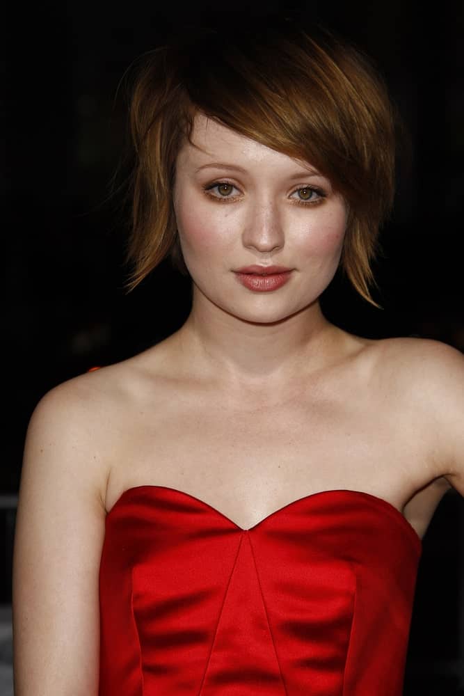 Emily Browning was at the premiere of 'Red Riding Hood' on March 7, 2011, at the Grauman's Chinese Theater in Los Angeles, California. She wore a red strapless dress with her chin-length brunette hairstyle that has long side-swept bangs.
