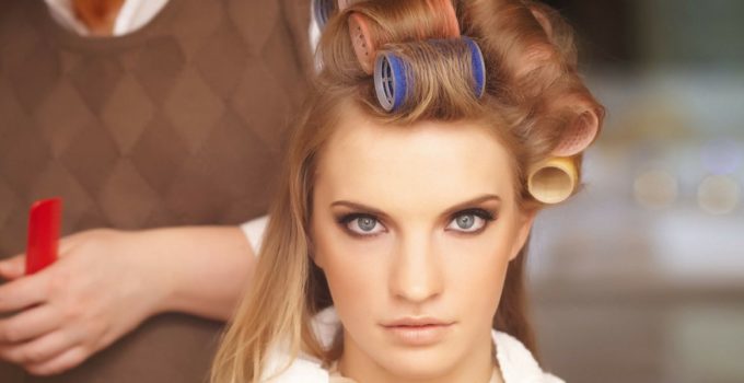 Woman with hair rollers in hair