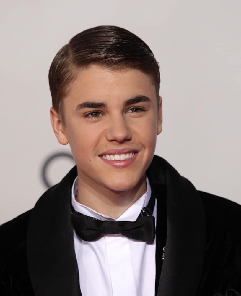 Justin Bieber gets gelled and went for a slicked down look at the American Music Awards 2011 in Los Angeles, CA.